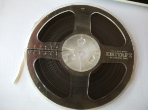 12r003 Found: Vintage radio forum submission, late 2012. Format: half track mono, 7” reel Content: singing.solo and choir; children playing 